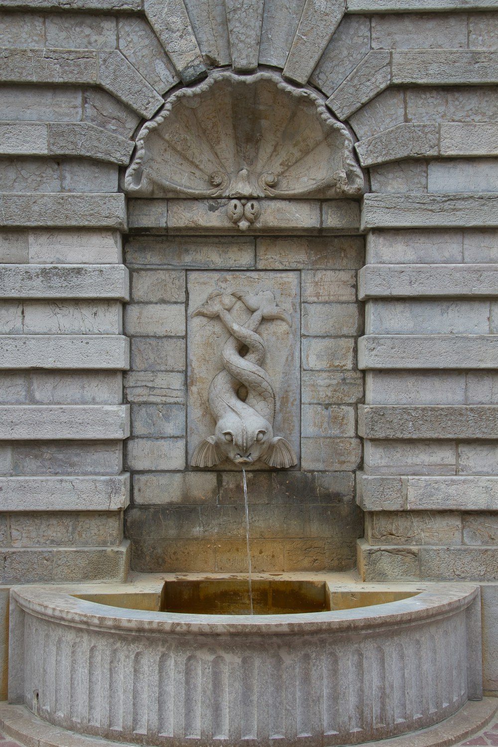 brown concrete fountain during daytime