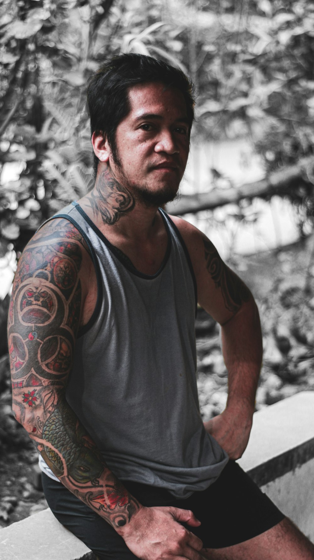 Man in black tank top with red and black tattoo on arm photo – Free Grey  Image on Unsplash