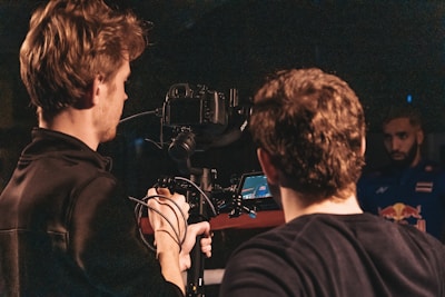 man in black jacket singing