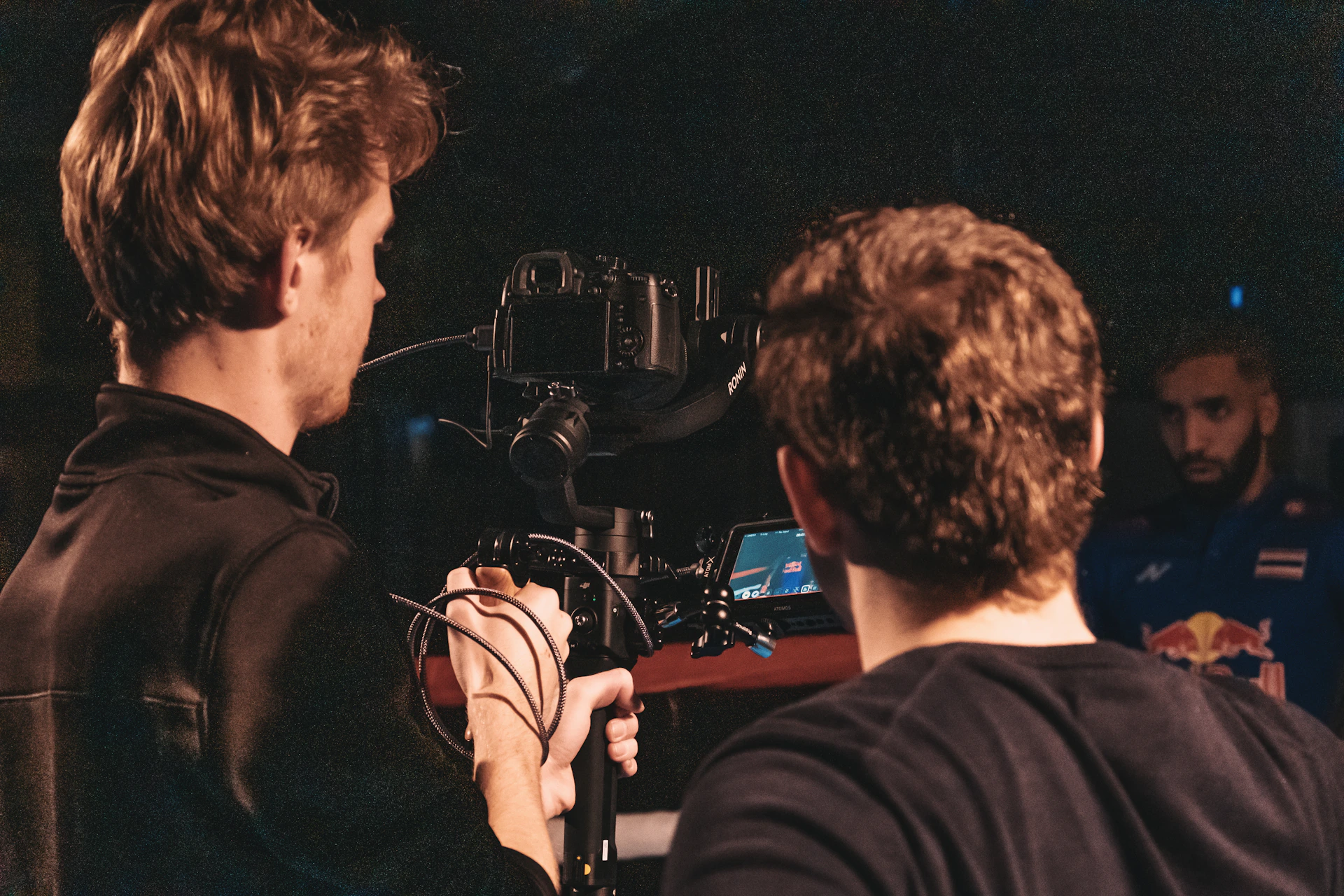 man in black jacket singing