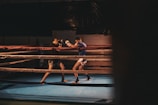 An intense sparring match taking place in a boxing ring.