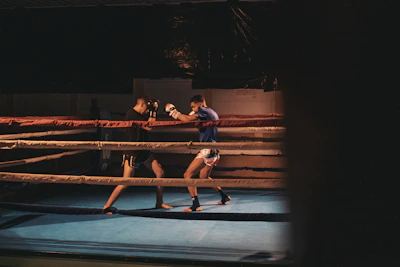 Teens sparring lightly in the ring during a focused training class.