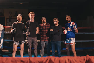 group of men standing on stage
