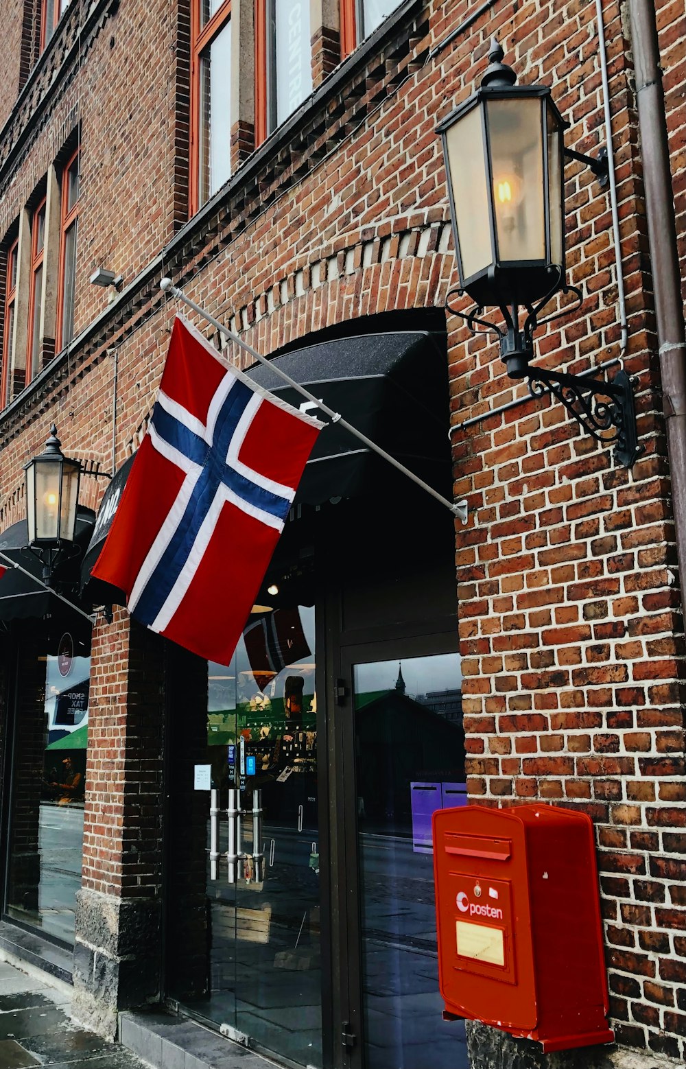 us a flag on brown brick building