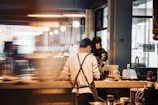 man and woman sitting on chair in front of table