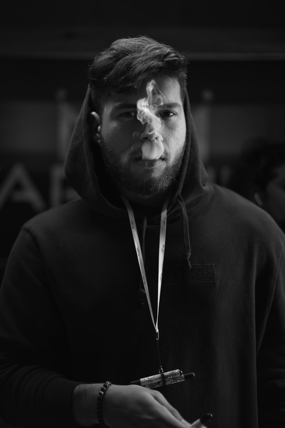 man in black hoodie in grayscale photography