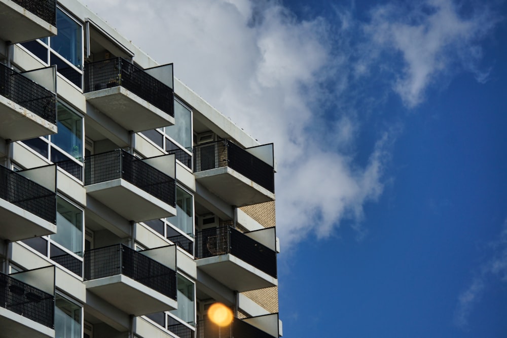 white and black concrete building under blue sky during daytime