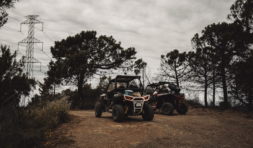 black and red atv on brown grass field