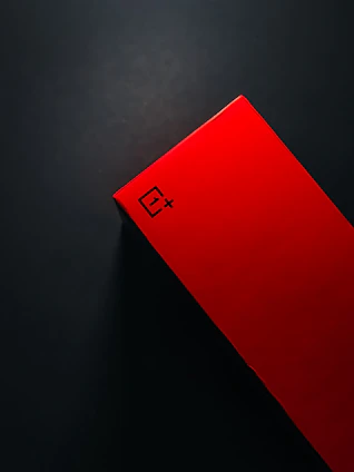 A vibrant small-sized box in bright red on a clean white background