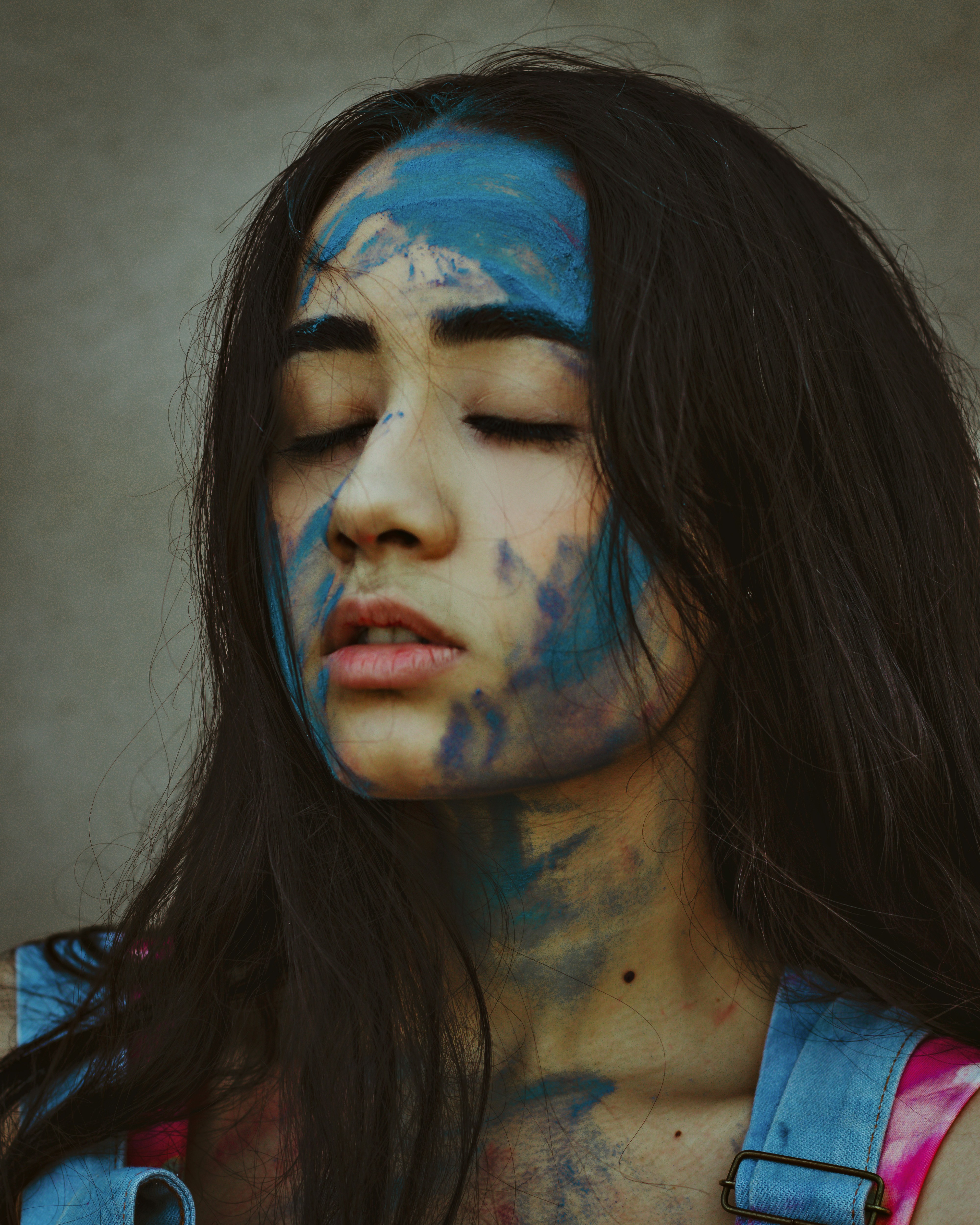woman in blue and white face paint