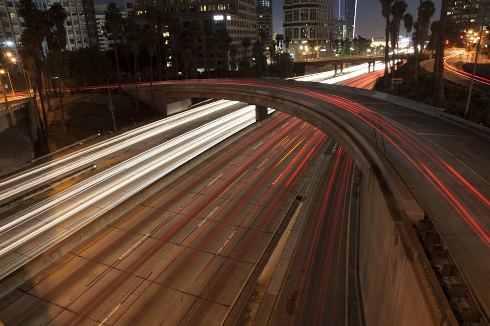 time lapse photography of cars on road during night time