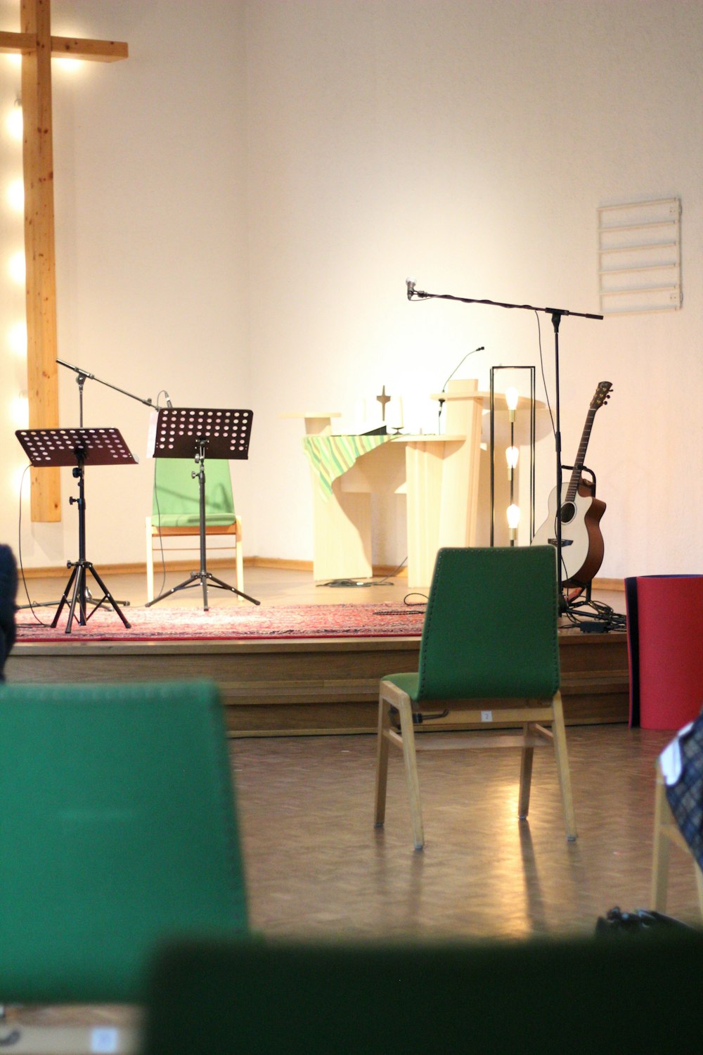 music band on stage with green chair