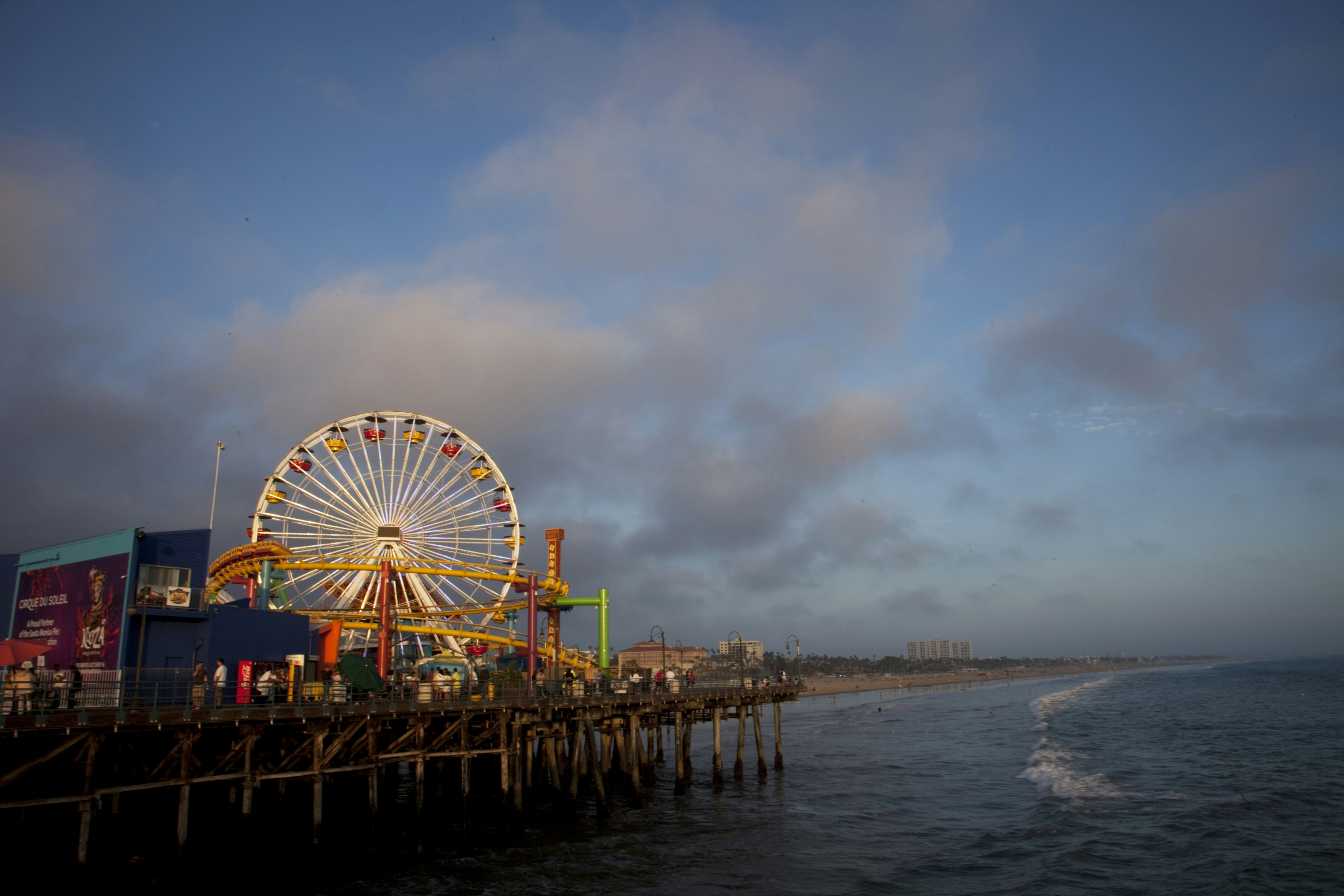 ferris wheel near body of water during daytime santa's helpers teams background