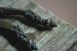 Close-up of finely crafted wooden wardrobe handles with a polished finish.