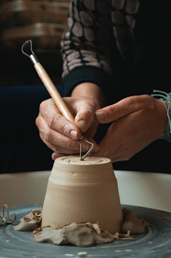 person doing pottery