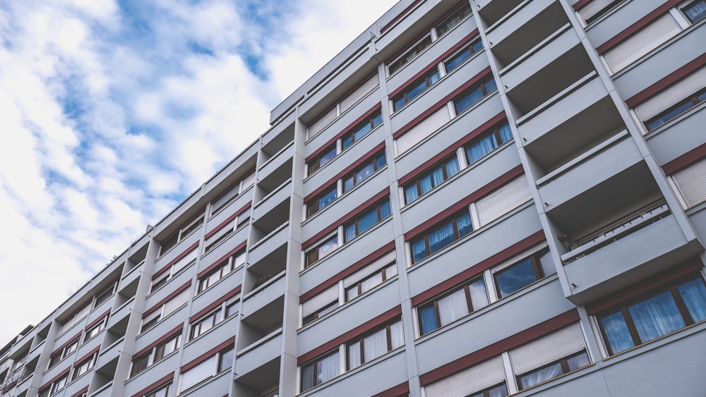 white and blue concrete building under blue sky during daytime