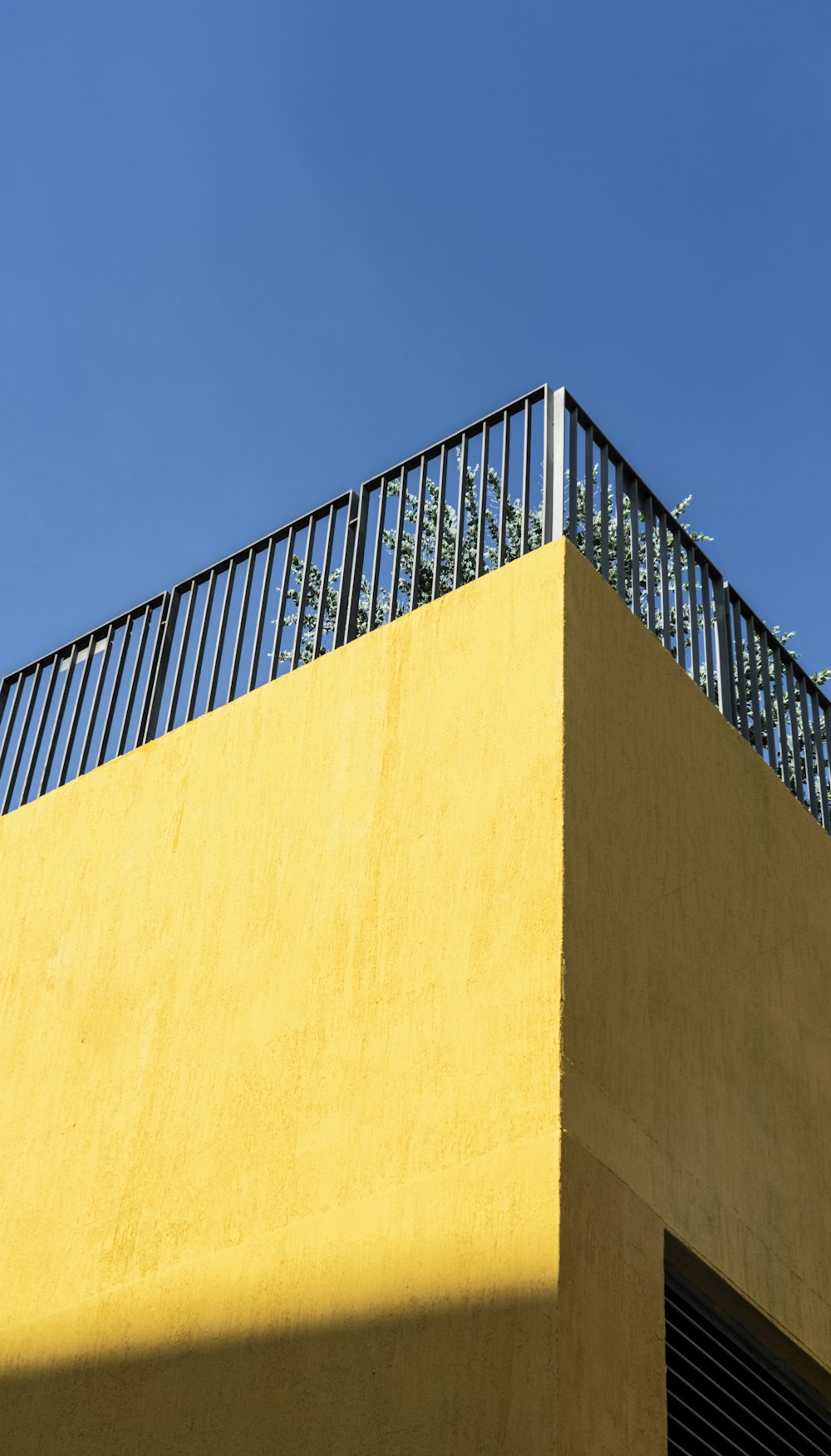 brown concrete wall under blue sky during daytime