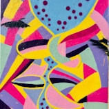 Photograph of a vibrant street art mural with dynamic shapes and colors.