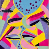 A vibrant street mural full of colorful abstract shapes and lively characters.