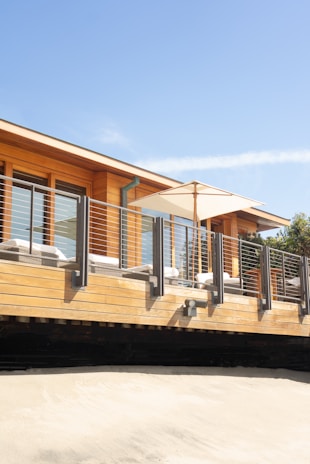 brown and white wooden house under blue sky during daytime