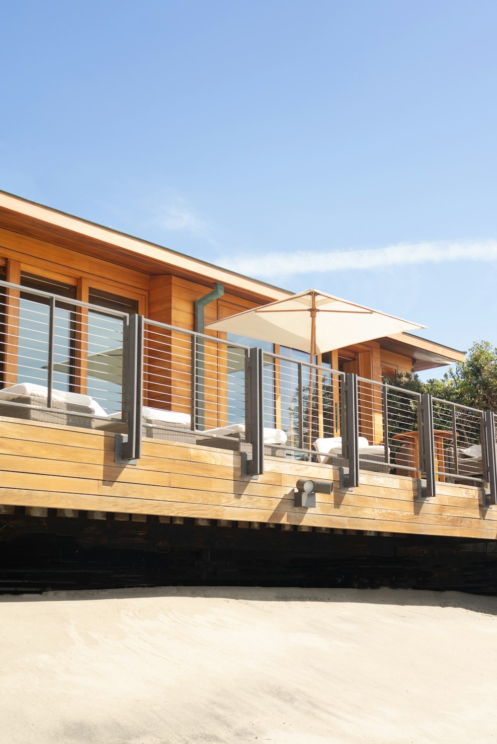 brown and white wooden house under blue sky during daytime