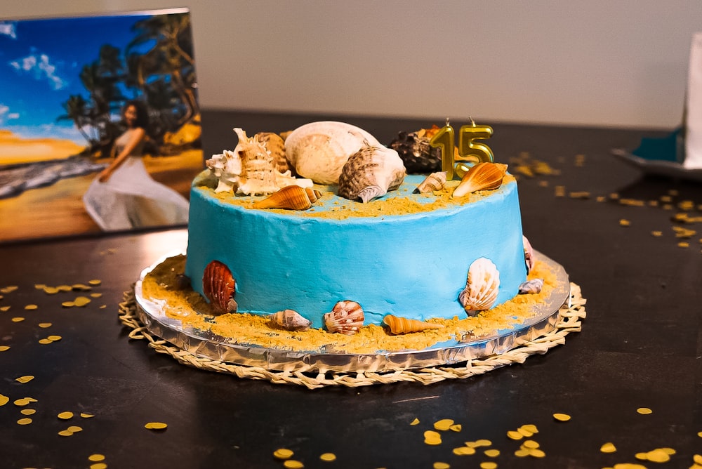 white and brown cake on blue and white round plate