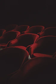 An inviting theater lobby with warm lighting and comfortable seating.