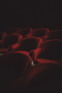 A smooth navigation menu with black background and red buttons on a theater booking site.