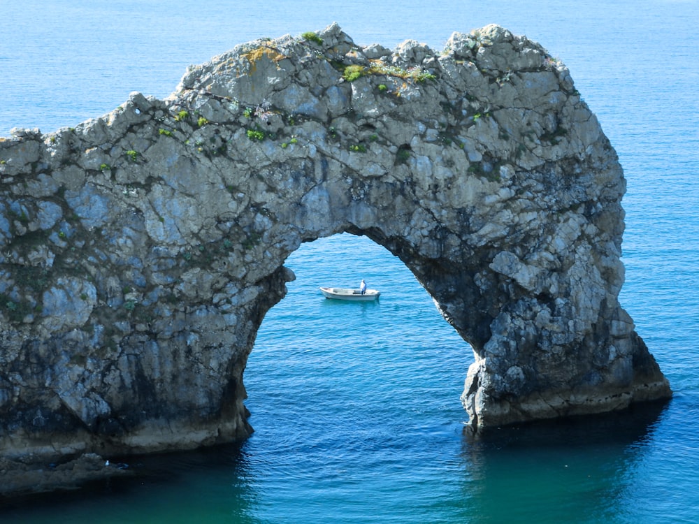 gray rock formation on blue sea during daytime