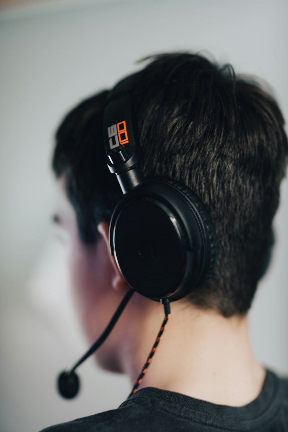 man wearing black headphones and black headphones