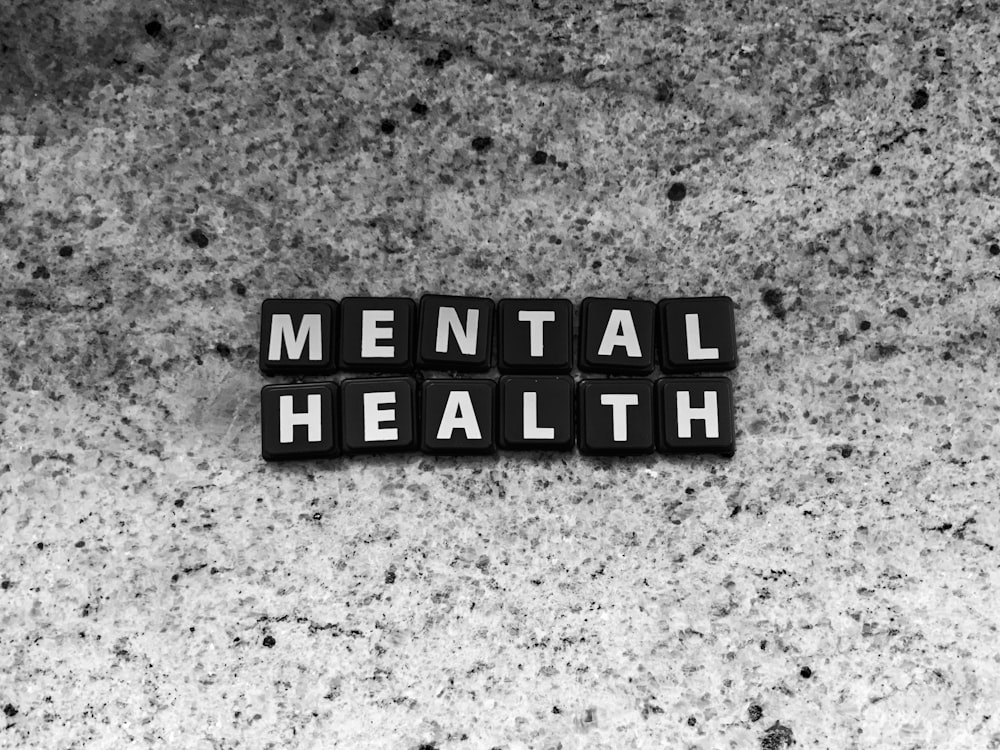 a black and white photo of the word mental health