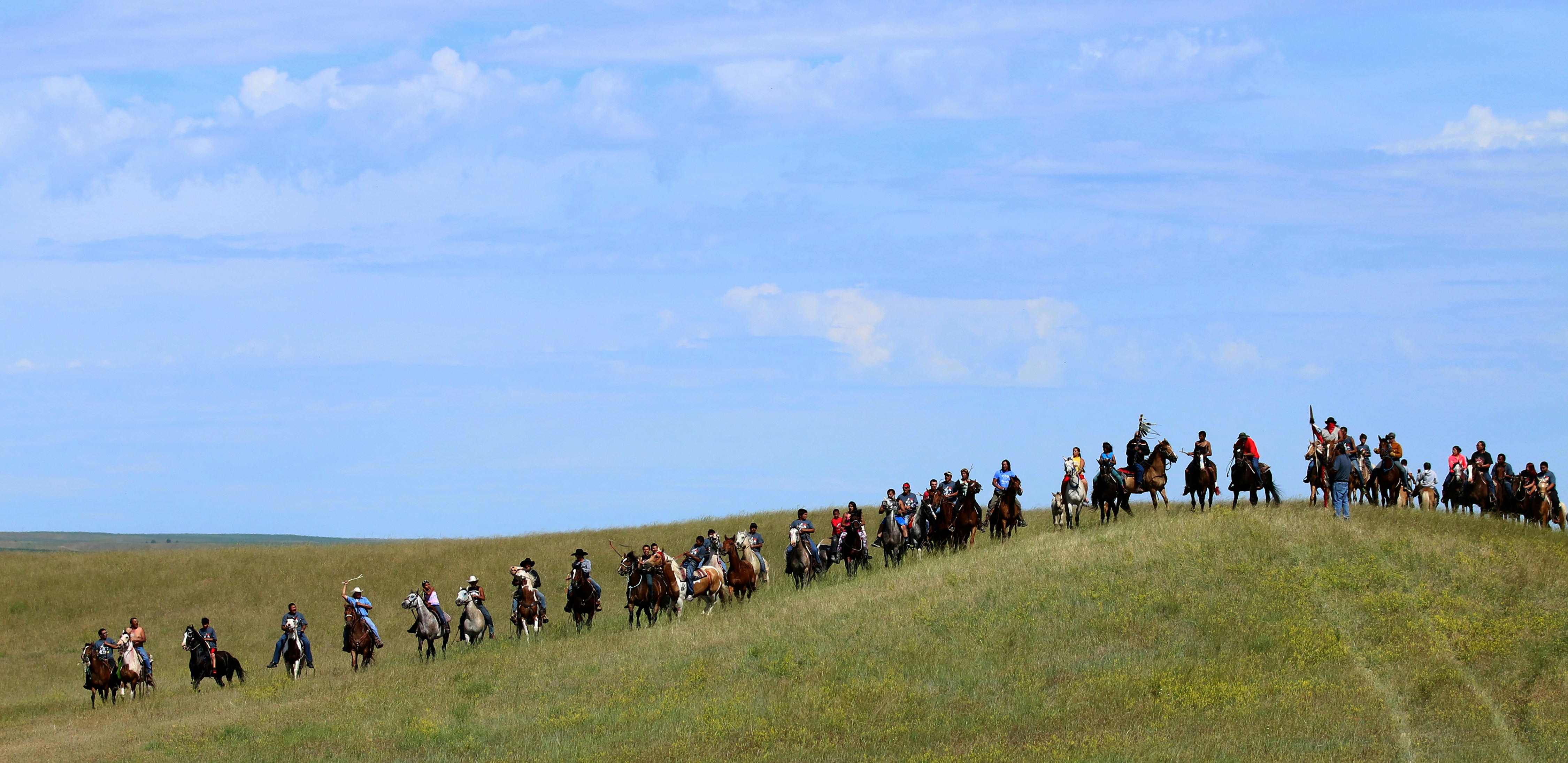Native American horse riders line up at Little Big Horn.