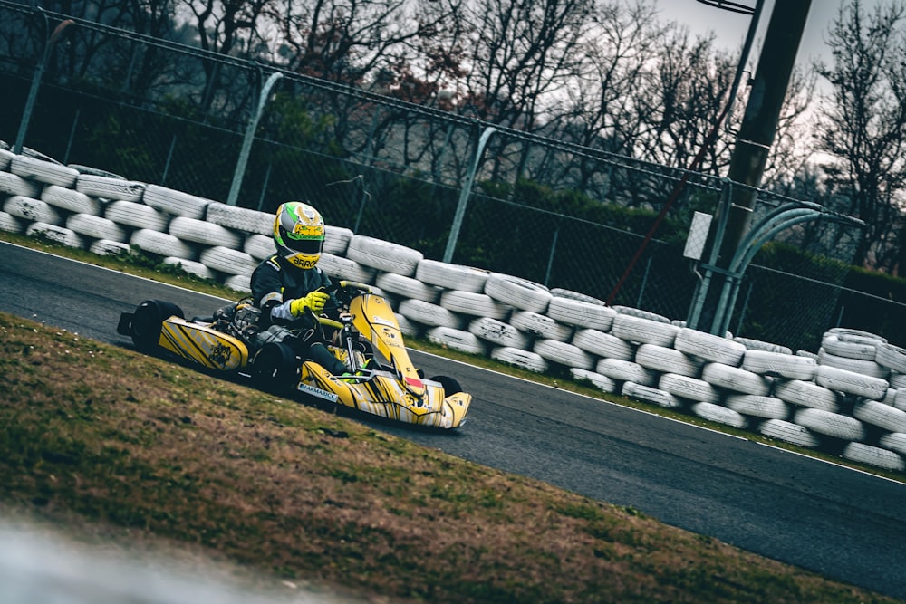 yellow and black go kart on track during daytime