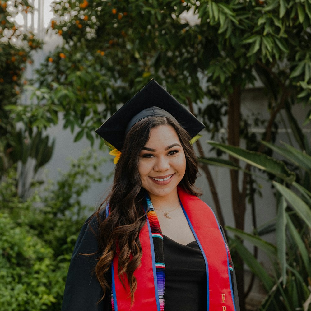 a woman in a graduation cap and gown