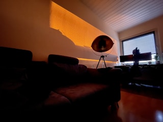 Modern workspace bathed in deep shadows and subtle highlights.