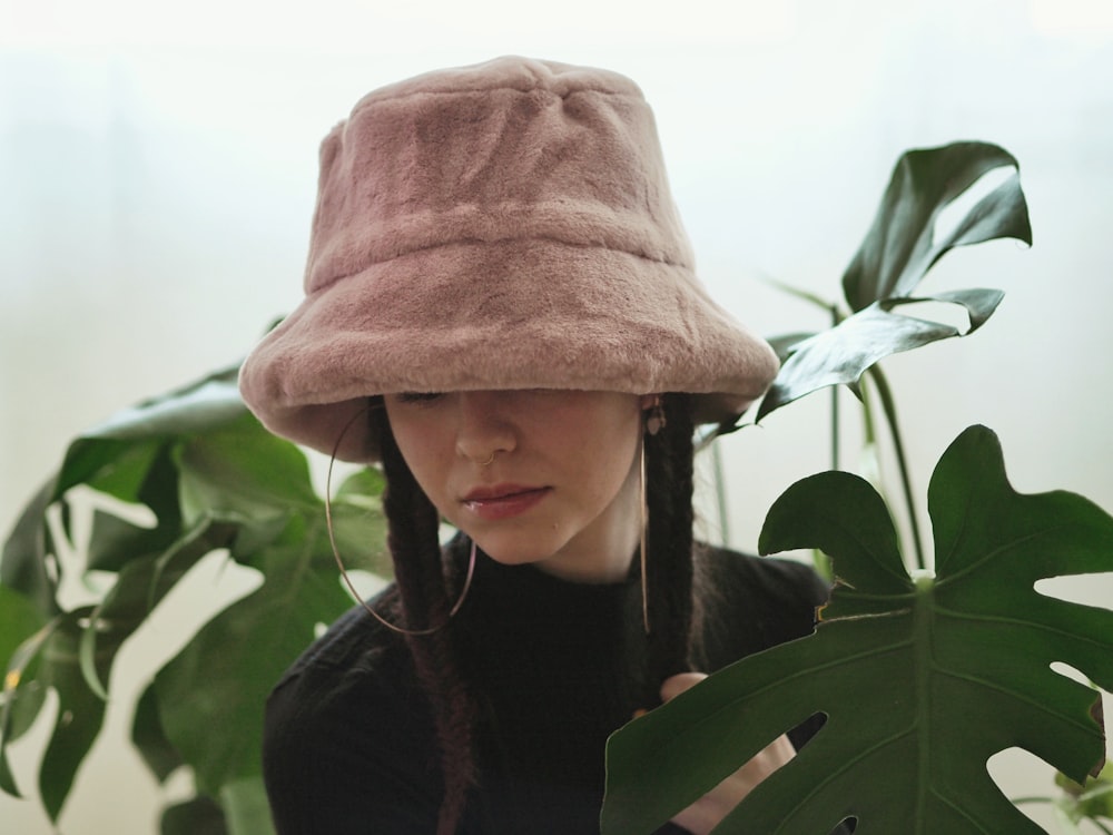 girl in brown hat and black jacket