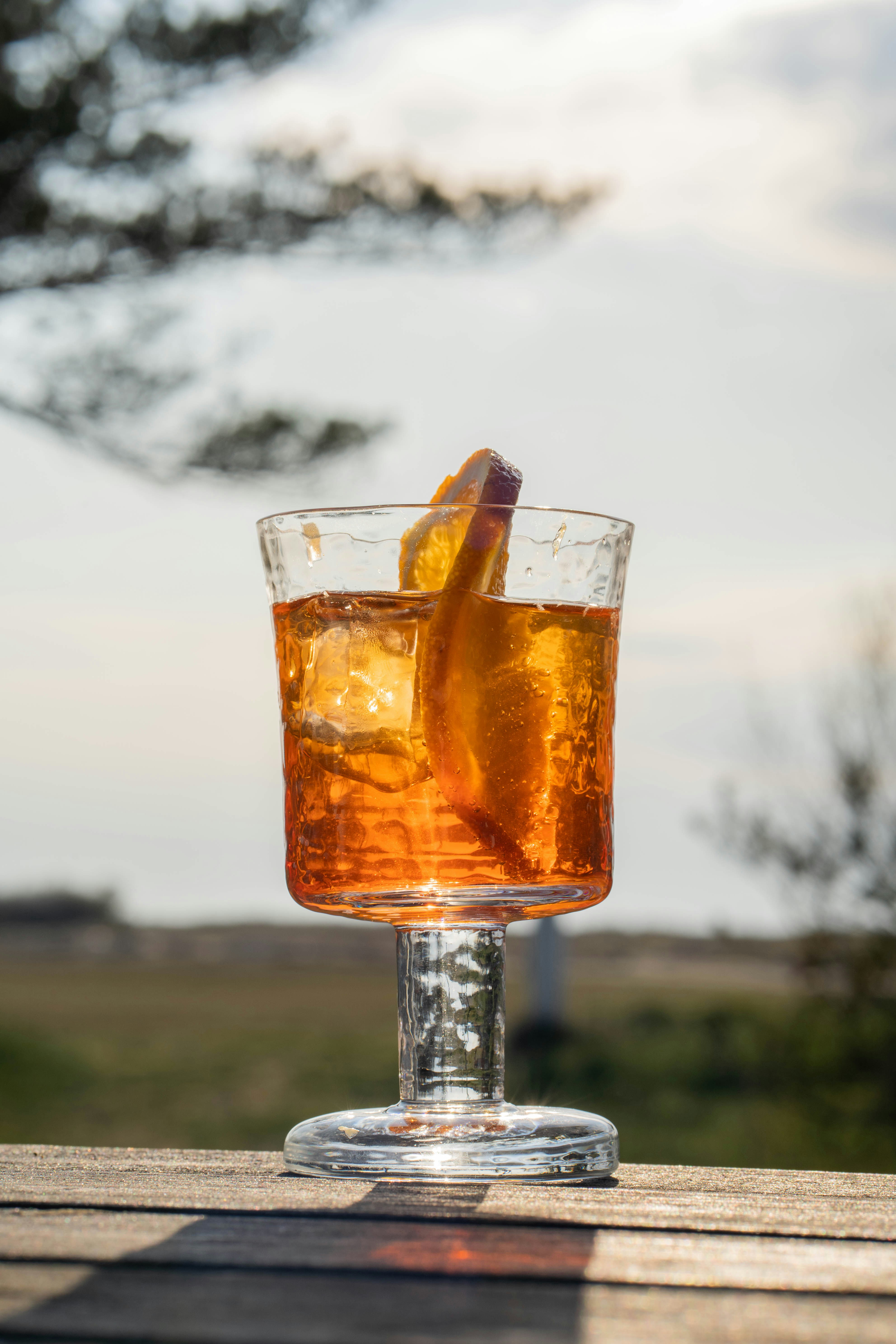 clear drinking glass with brown liquid