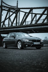 black bmw m 3 coupe on bridge