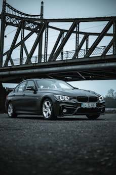 black bmw m 3 coupe on bridge
