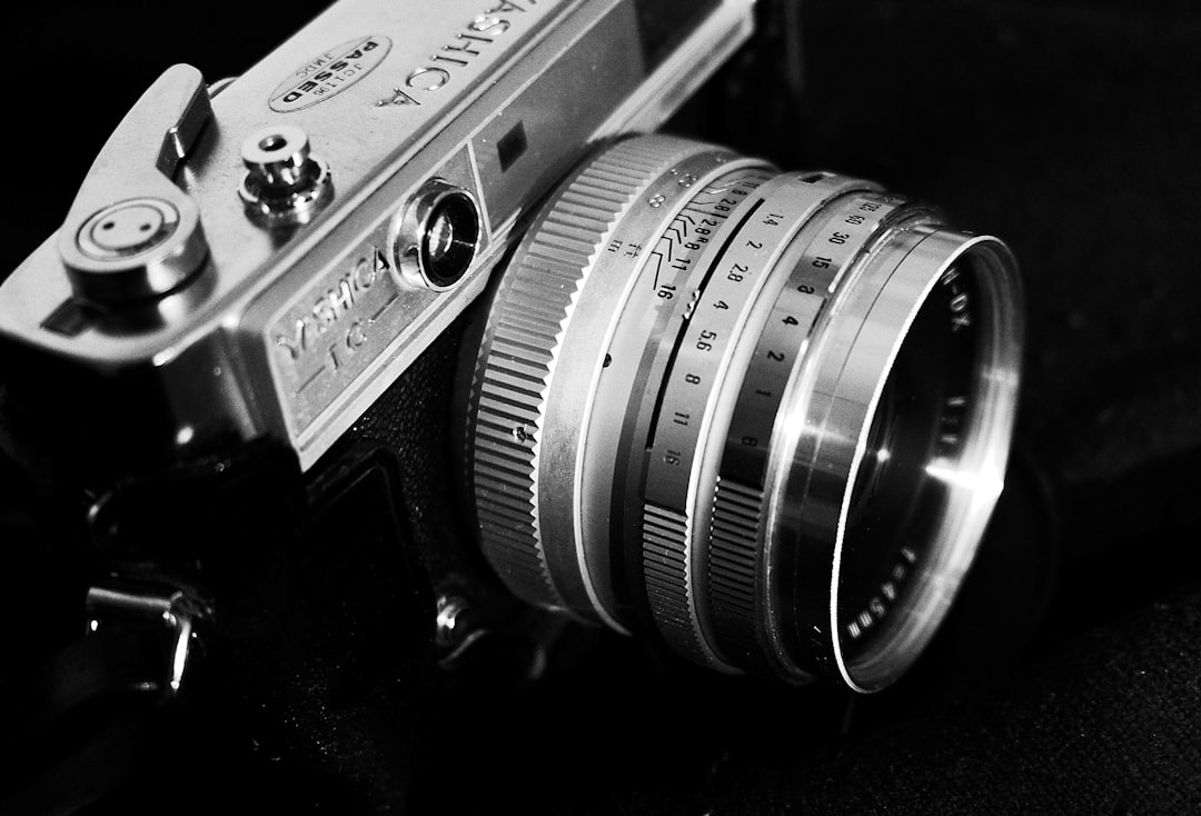 black and silver nikon camera lens
