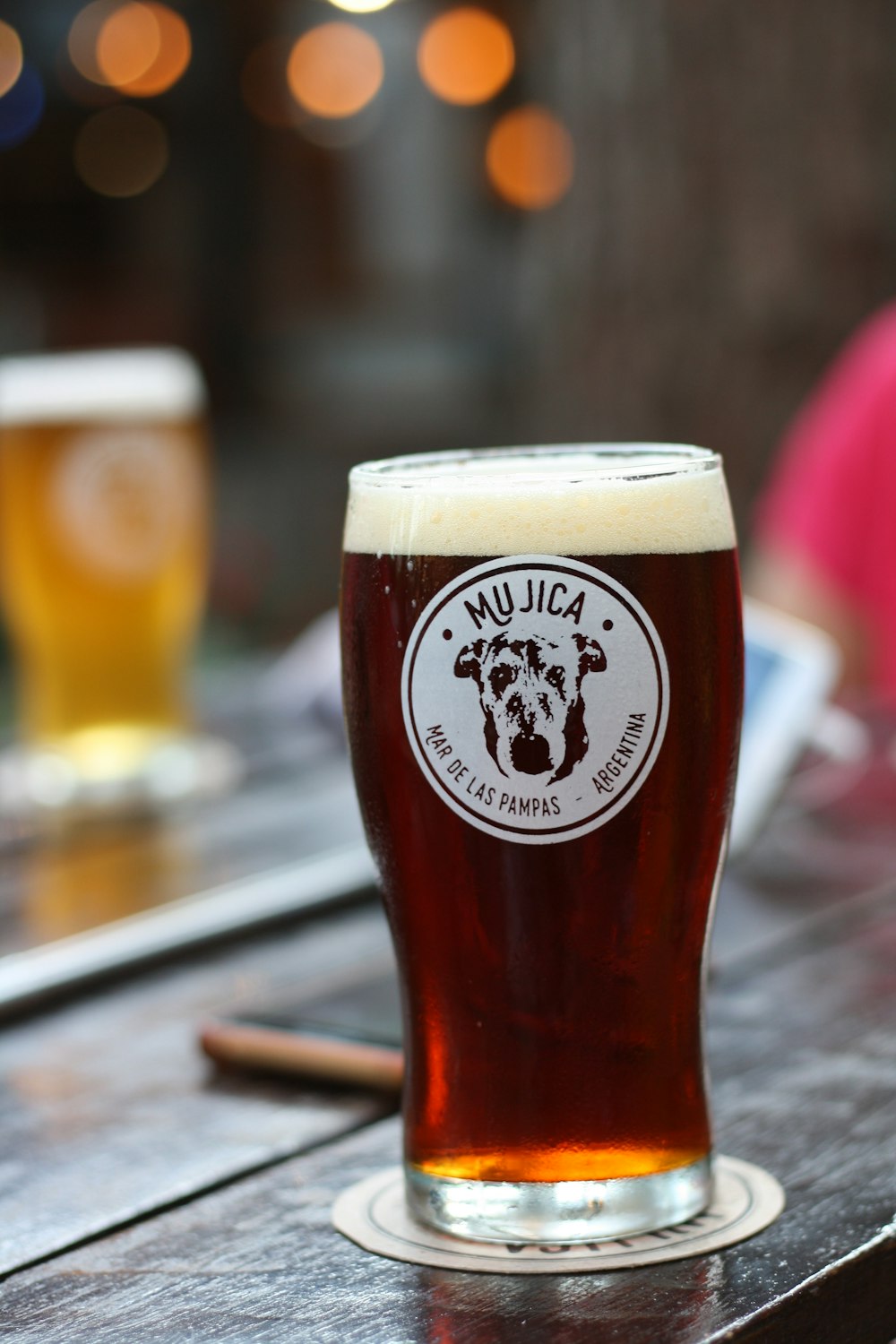 clear drinking glass with brown liquid