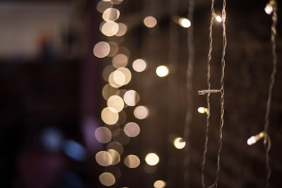 Romantic golden textured photo booth setup with soft glowing lights.