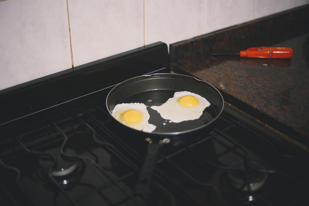 white ceramic plate on black stove