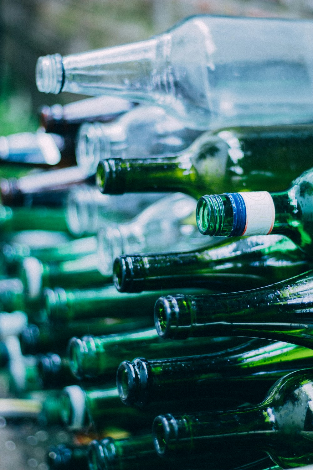 Big Glass Bottle of Wine Empty, on Green Grass Background. Stock