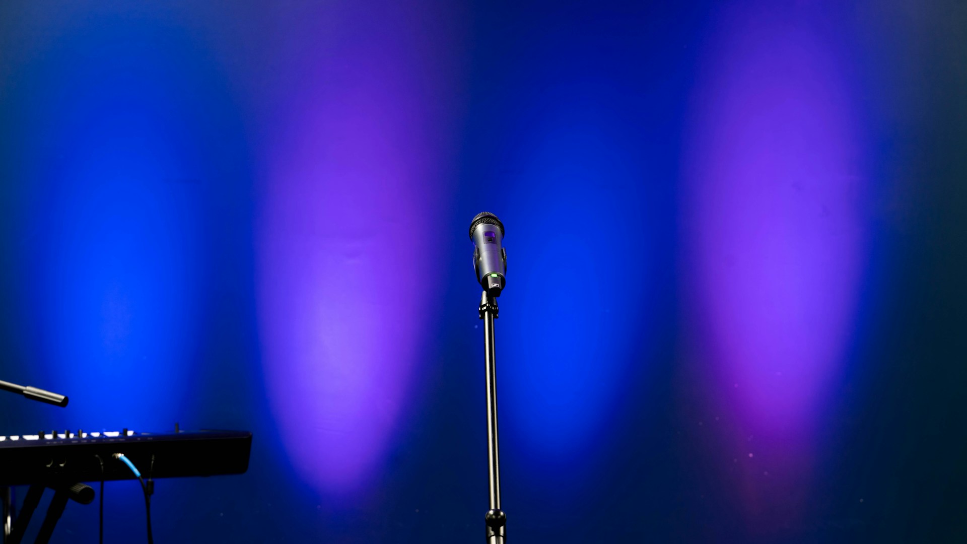 black microphone on black microphone stand