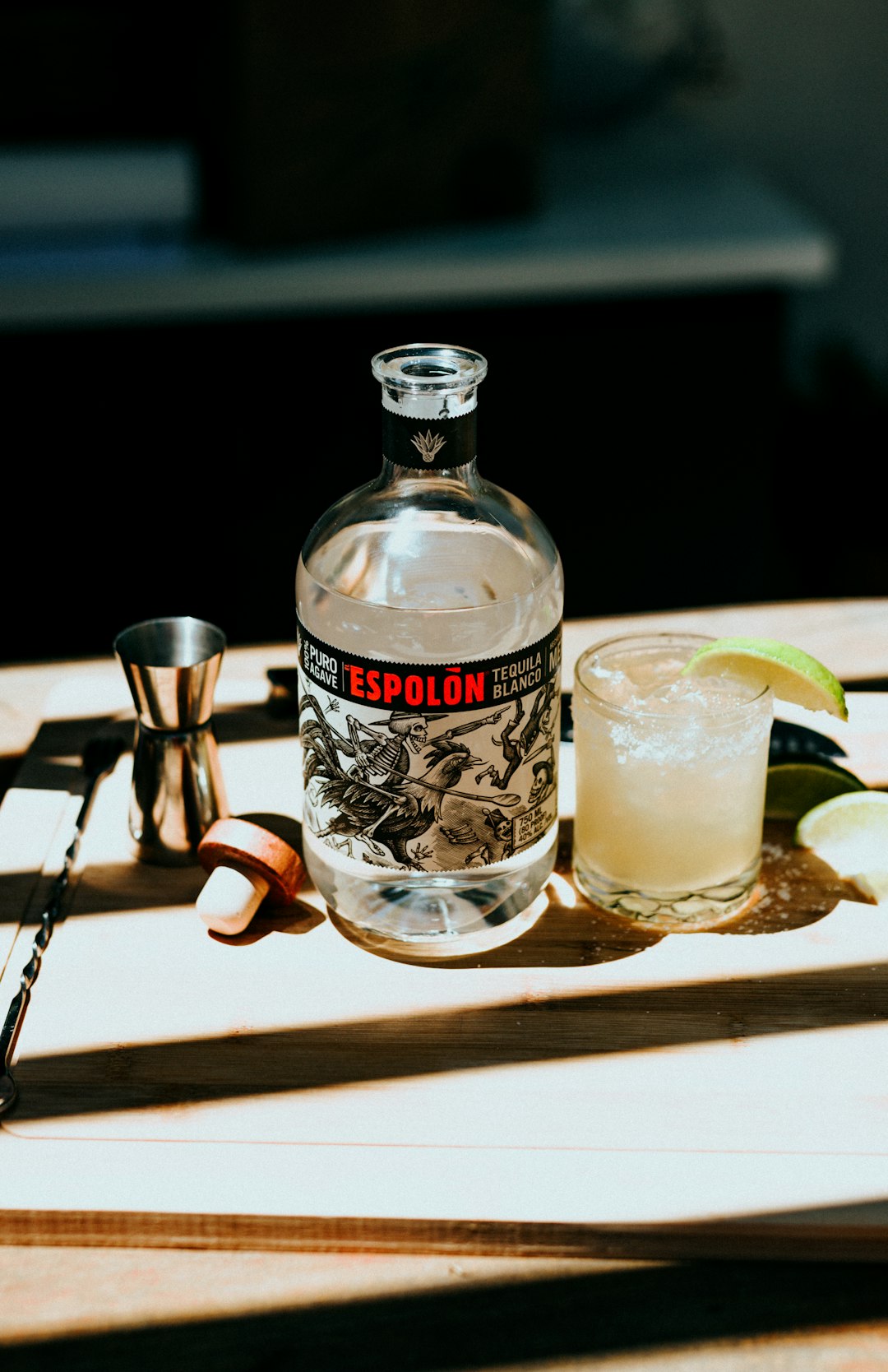 Espolòn Tequila bottle next to cocktail