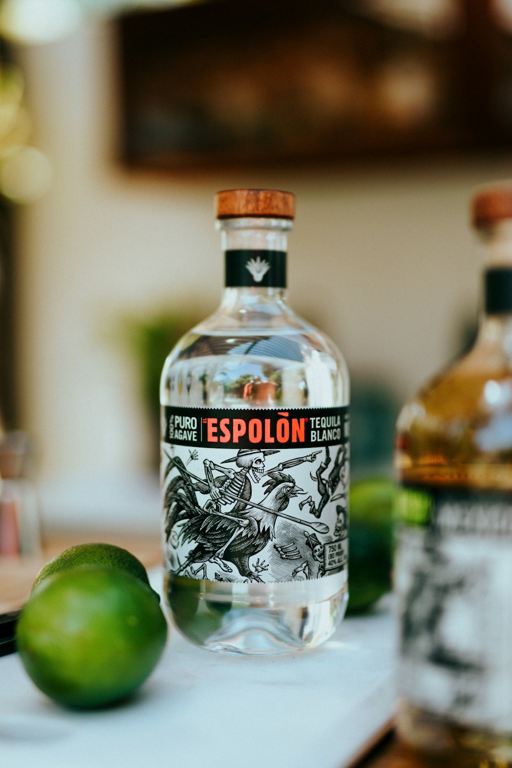 Espolòn Tequila bottle with limes