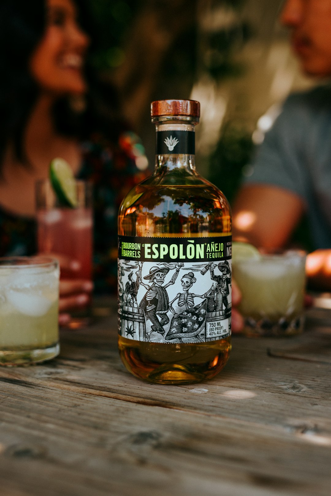 Espolòn Tequila bottle beside cocktail