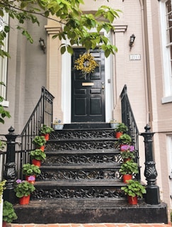 An inviting entryway adorned with a handmade black and yellow wreath.