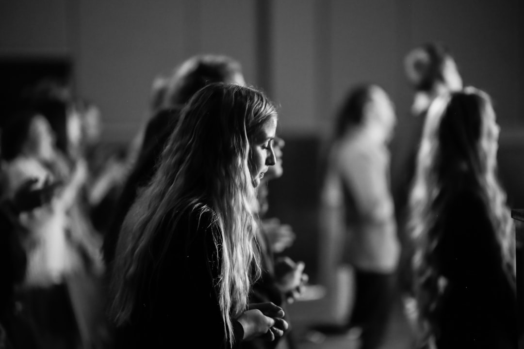 grayscale photo of woman in black and white shirt